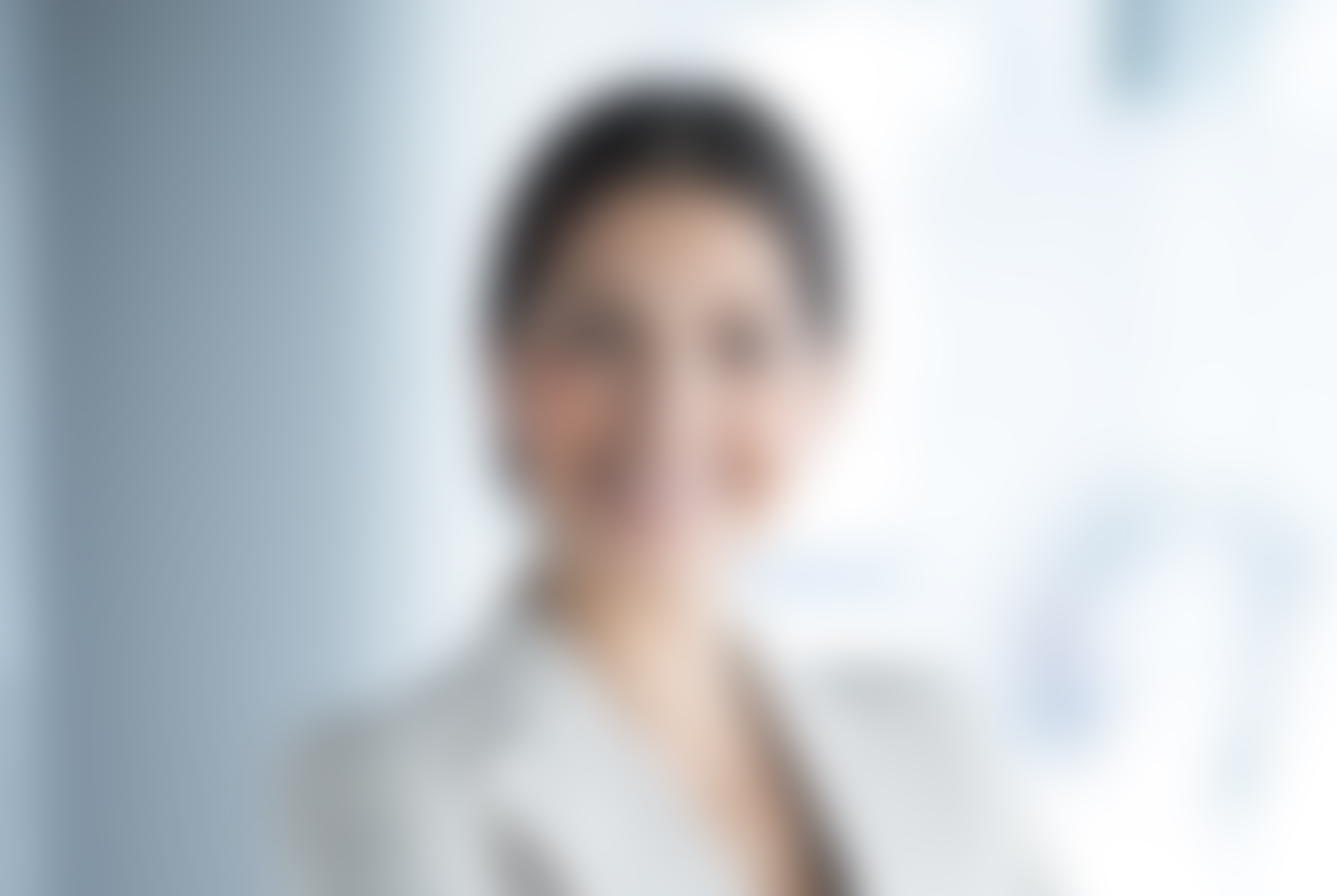 Smiling Female Business Leader With Arms Crossed